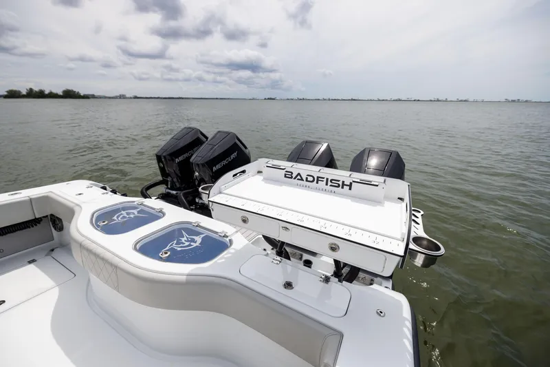 Slide: The Image of 2025 Freeman 42 LR boat with Mercury engines on a calm sea. - 28