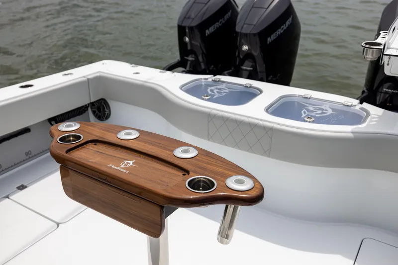 Slide: The Image of Freeman 42 LR 2025 boat with wooden rod holder and Mercury engines. - 29
