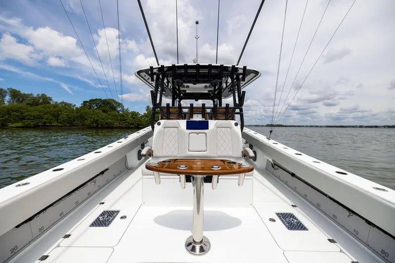 Slide: The Image of 2025 Freeman 42 LR boat on water, featuring sleek design and modern amenities. - 31