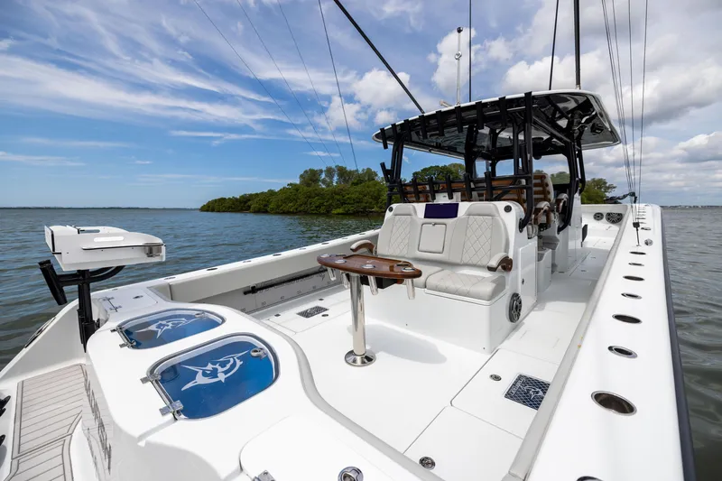 Slide: The Image of Freeman 42 LR 2025 boat on water, featuring spacious seating and modern design. - 32
