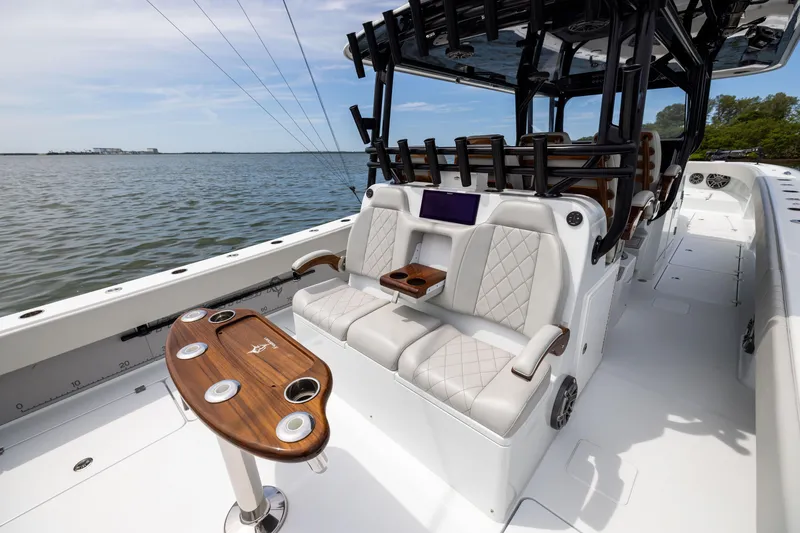 Slide: The Image of Luxurious 2025 Freeman 42 LR boat interior with plush seating and elegant wooden table. - 36