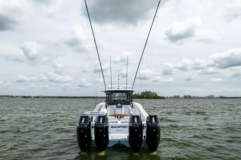 Slide: The Image of Freeman 42 LR 2025 boat with four engines on a cloudy day at sea. - 4
