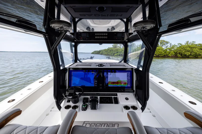 Slide: The Image of Interior view of 2025 Freeman 42 LR boat cockpit with advanced navigation system. - 40