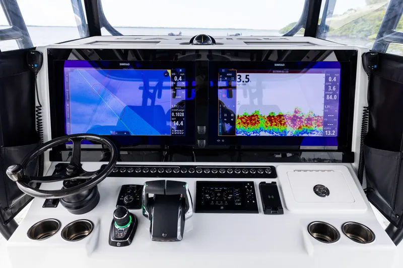 Slide: The Image of Freeman 42 LR 2025 boat dashboard with advanced navigation and control systems. - 42