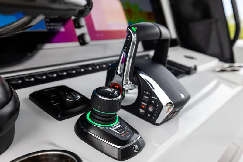 Slide: The Image of Control panel of 2025 Freeman 42 LR boat with joystick and throttle. - 46