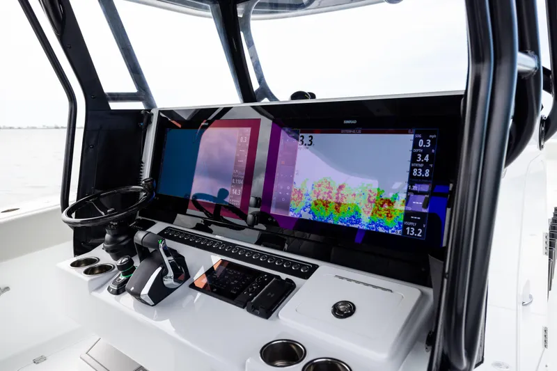 Slide: The Image of Freeman 42 LR 2025 boat dashboard with advanced navigation display and controls. - 48
