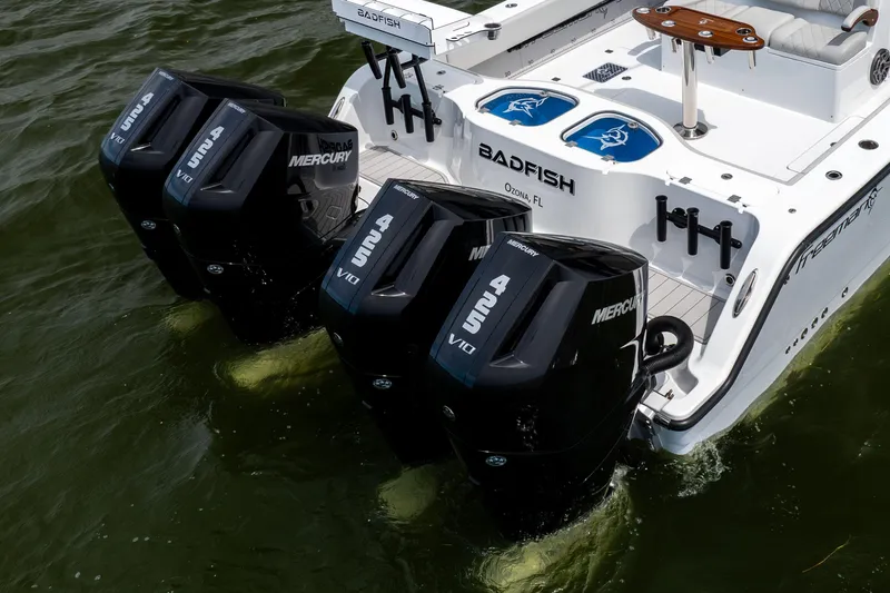 Slide: The Image of Freeman 42 LR 2025 boat with four Mercury outboard engines on water. - 5