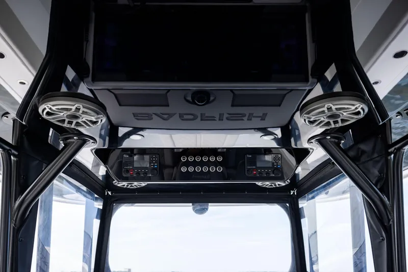 Slide: The Image of Interior view of 2025 Freeman 42 LR boat, featuring advanced control panel and speakers. - 51