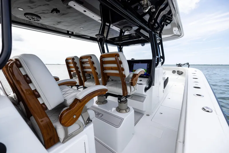 Slide: The Image of Luxury interior of 2025 Freeman 42 LR boat with elegant seating and advanced controls. - 53