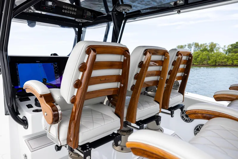 Slide: The Image of Luxurious interior of 2025 Freeman 42 LR boat with elegant seating and advanced navigation system. - 57