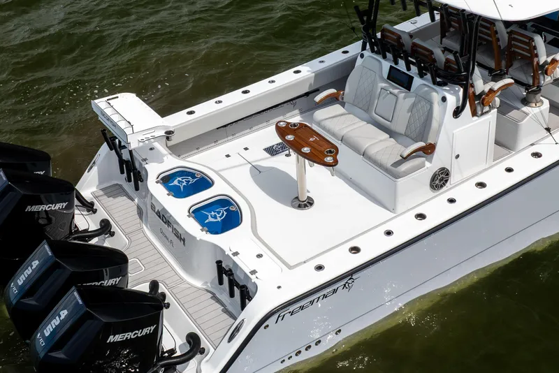 Slide: The Image of 2025 Freeman 42 LR boat with Mercury engines, spacious seating, and fishing amenities. - 6