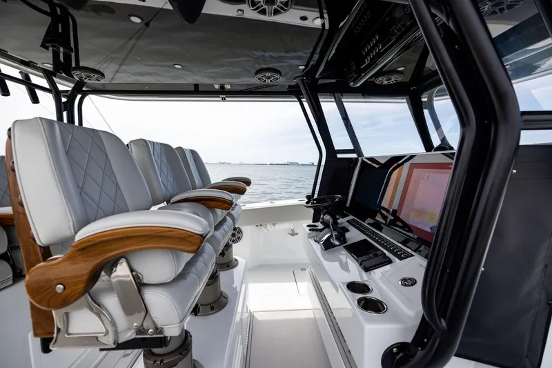 Slide: The Image of Luxurious interior of 2025 Freeman 42 LR boat with modern seating and advanced navigation system. - 64