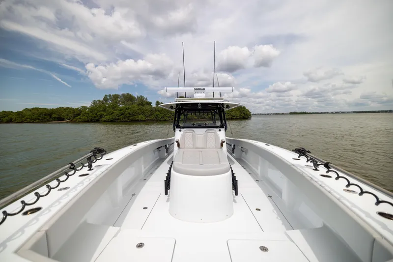 Slide: The Image of 2025 Freeman 42 LR boat on calm water, featuring spacious deck and modern design. - 67