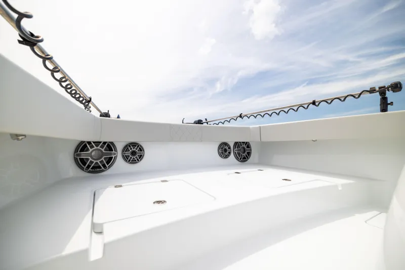 Slide: The Image of 2025 Freeman 42 LR boat interior with speakers and storage compartments under a clear sky. - 76