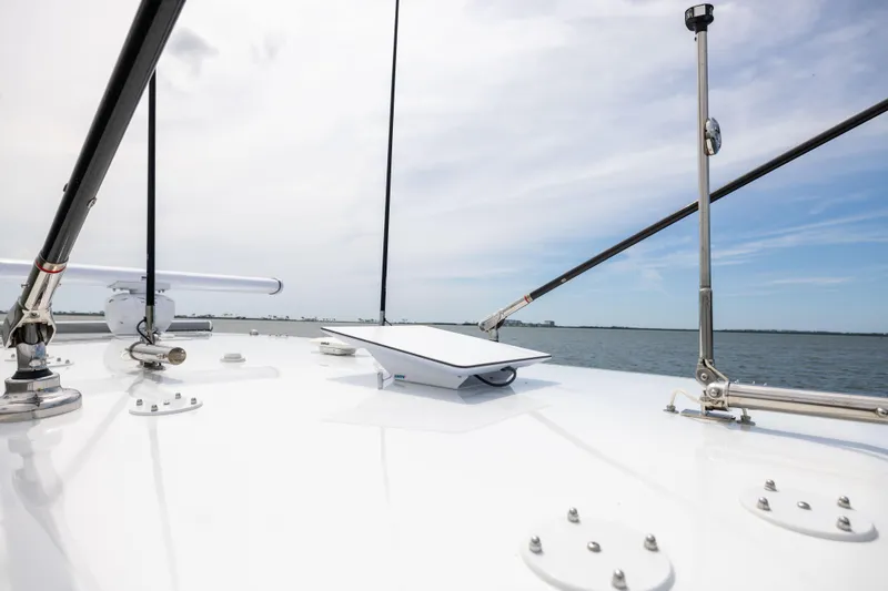 Slide: The Image of Freeman 42 LR 2025 boat deck with clear sky and ocean view. - 80
