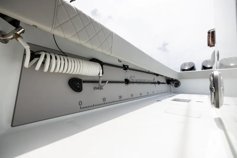 Slide: The Image of 2025 Freeman 42 LR boat interior with coiled hose and measurement markings. - 84