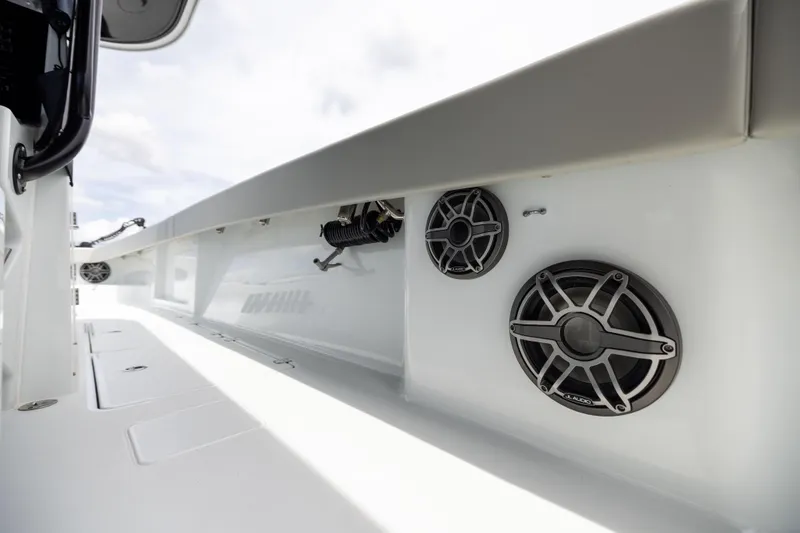 Slide: The Image of 2025 Freeman 42 LR boat interior with speakers and sleek design. - 85