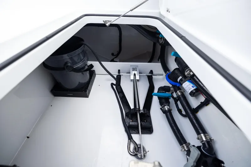 Slide: The Image of Interior view of 2025 Freeman 42 LR boat compartment with anchor and plumbing. - 89