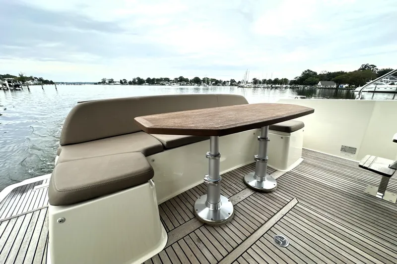 Slide: The Image of Luxury seating area on 2014 Prestige 450 yacht with scenic water view. - 14
