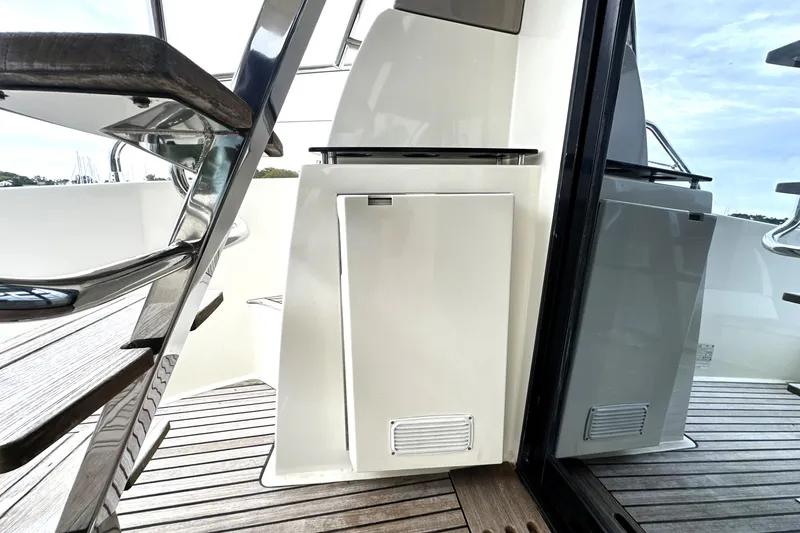 Slide: The Image of 2014 Prestige 450 yacht interior with sleek design and wooden flooring. - 16