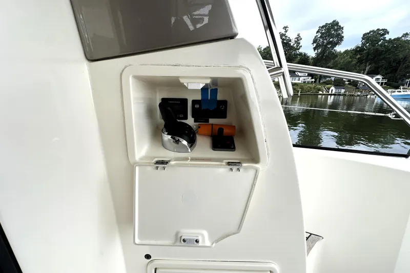 Slide: The Image of Control panel on a 2014 Prestige 450 yacht, overlooking a serene waterfront. - 17
