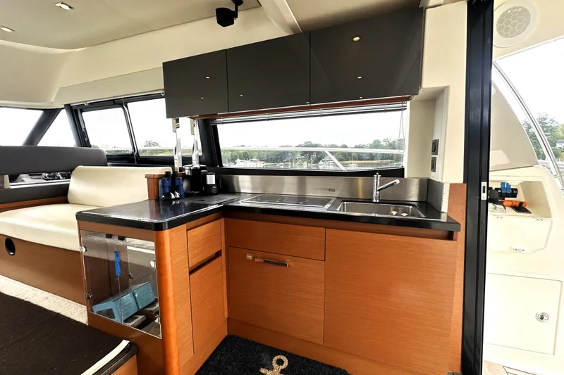Slide: The Image of Luxurious interior of 2014 Prestige 450 yacht with modern kitchen and seating area. - 32