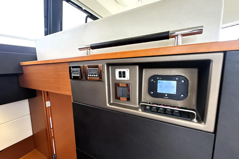 Slide: The Image of Control panel of a 2014 Prestige 450 yacht with modern navigation equipment. - 36