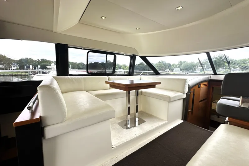 Slide: The Image of Luxurious interior of 2014 Prestige 450 yacht with elegant seating and panoramic windows. - 38