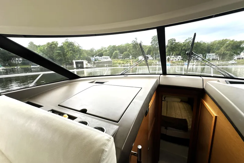 Slide: The Image of Interior view of 2014 Prestige 450 yacht, showcasing helm and cabin area. - 41