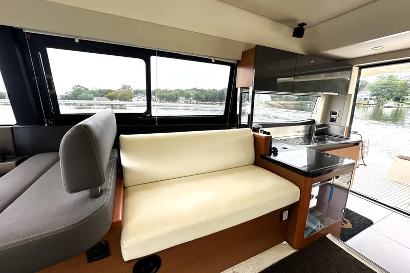 Slide: The Image of Luxurious interior of a 2014 Prestige 450 yacht with modern seating and kitchenette. - 43