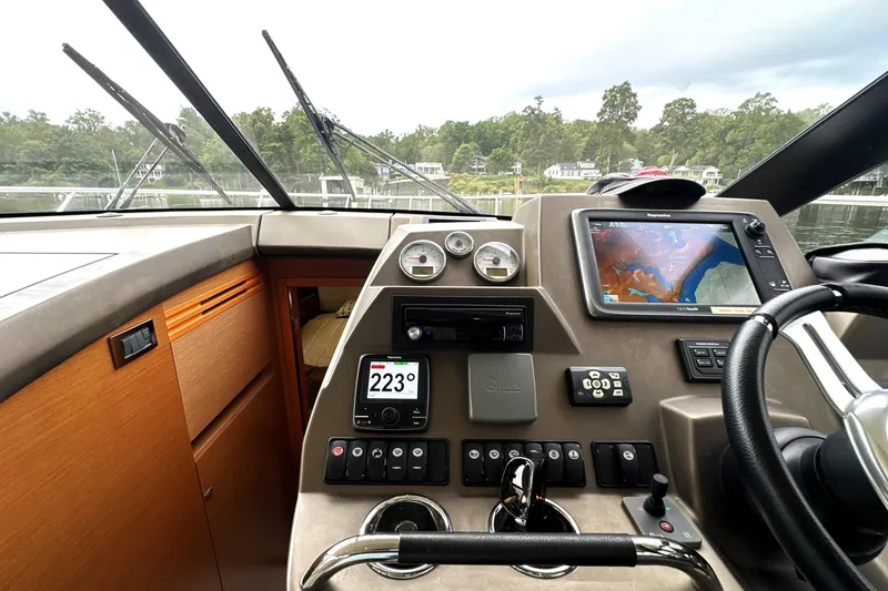 Slide: The Image of Cockpit of 2014 Prestige 450 yacht with navigation system and controls. - 49