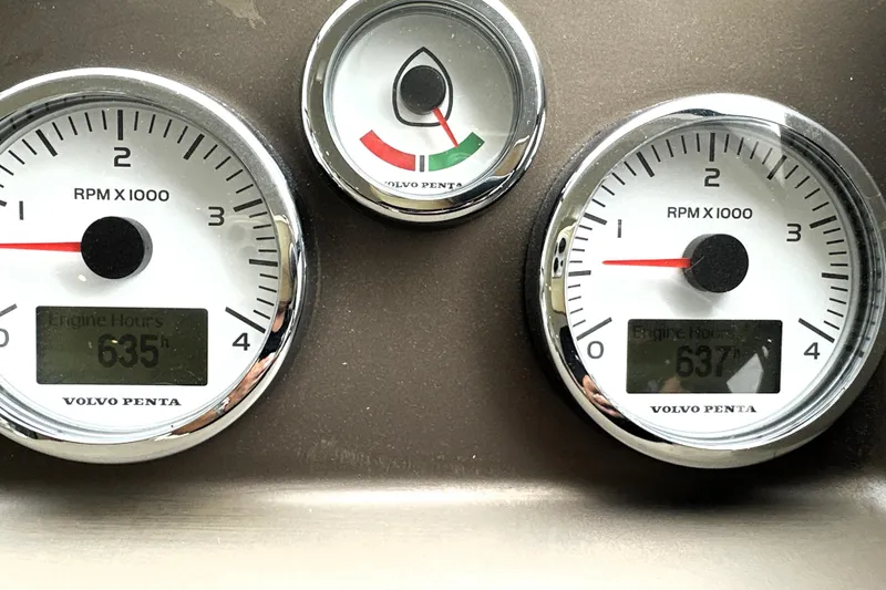 Slide: The Image of Dashboard of a 2014 Prestige 450 with Volvo Penta gauges displaying engine hours. - 50