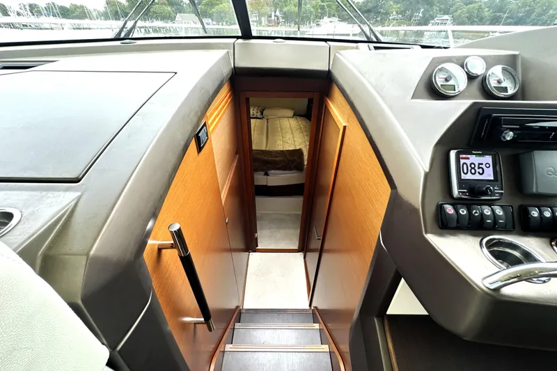 Slide: The Image of Interior view of 2014 Prestige 450 yacht cockpit with stairs leading to cabin. - 51