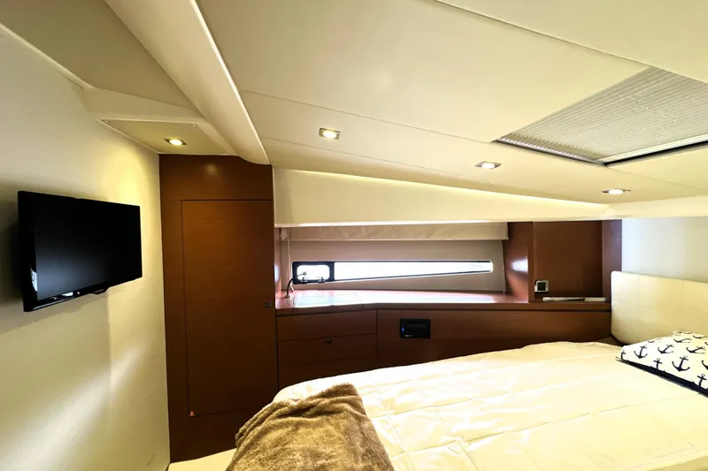 Slide: The Image of Luxurious cabin interior of a 2014 Prestige 450 yacht with modern amenities and elegant design. - 53