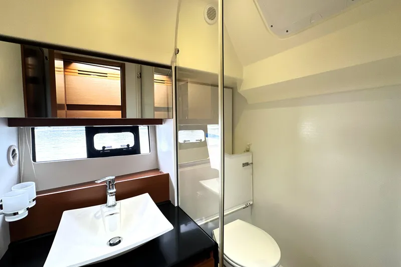 Slide: The Image of Luxurious bathroom in 2014 Prestige 450 yacht with modern fixtures and natural light. - 56