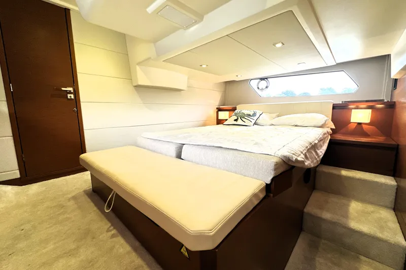 Slide: The Image of Luxurious bedroom interior of 2014 Prestige 450 yacht with modern design and cozy lighting. - 60