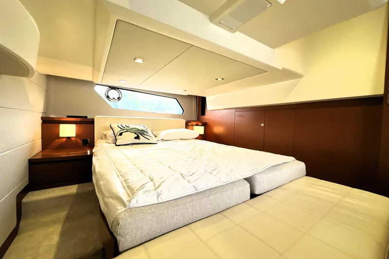 Slide: The Image of Luxurious cabin interior of 2014 Prestige 450 yacht with cozy bed and elegant decor. - 61