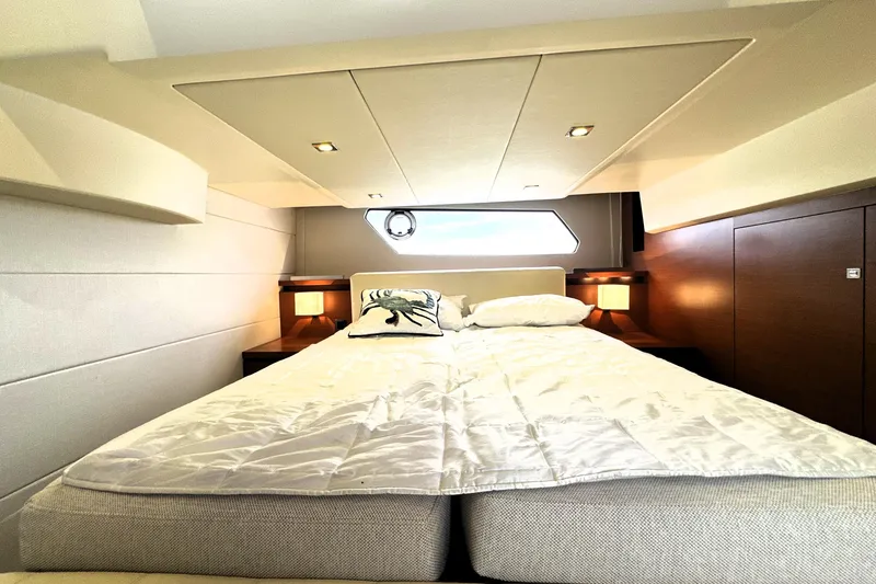 Slide: The Image of Luxurious bedroom interior of 2014 Prestige 450 yacht with elegant bedding and ambient lighting. - 63