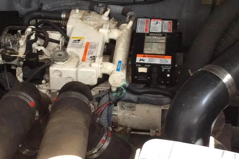 Slide: The Image of Engine compartment of a 2003 Sea Ray 320 Sundancer boat. - 7