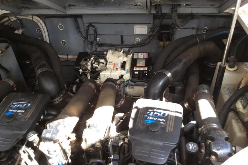 Slide: The Image of Engine compartment of a 2003 Sea Ray 320 Sundancer with MerCruiser 350 MAG MPI engines. - 8