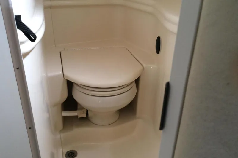 Slide: The Image of Compact marine toilet in 2003 Sea Ray 320 Sundancer boat bathroom. - 9