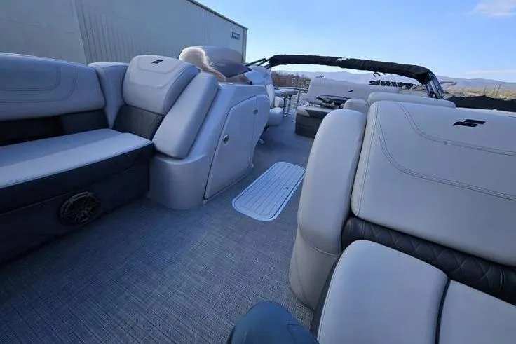 Slide: The Image of 2023 Starcraft CX 23 DL BAR pontoon boat interior with plush seating and modern design. - 4