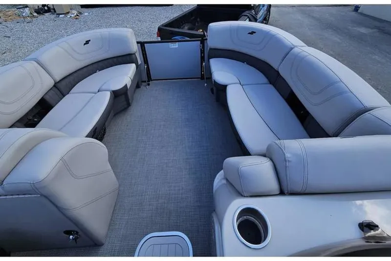 Slide: The Image of 2023 Starcraft CX 23 DL BAR pontoon boat interior with gray seating and flooring. - 5