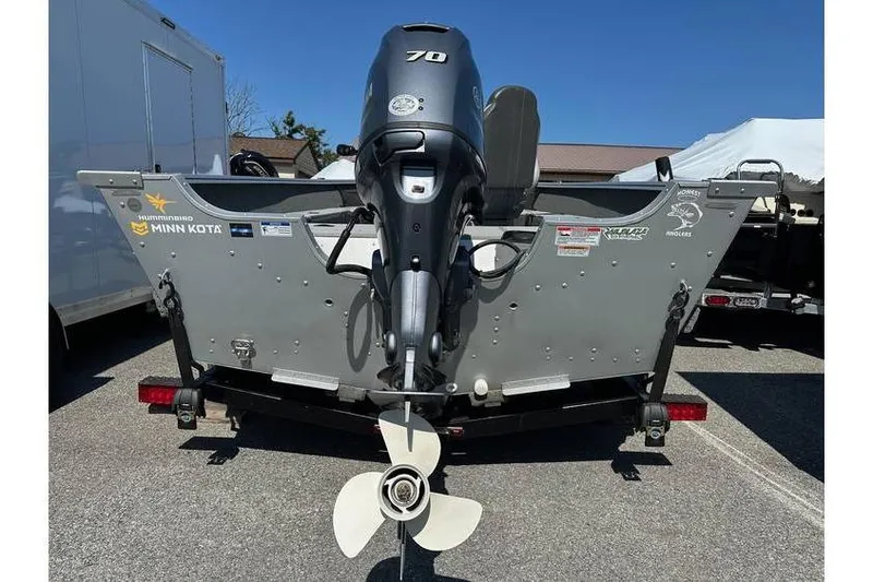 Slide: The Image of 2021 Starcraft Delta 168 Tiller boat with Yamaha F70LA engine and trailer, rear view. - 10