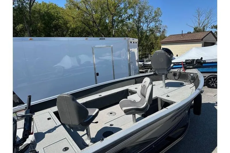 Slide: The Image of 2021 Starcraft Delta 168 Tiller boat with Yamaha F70LA, trailer, and seating, outdoors. - 11