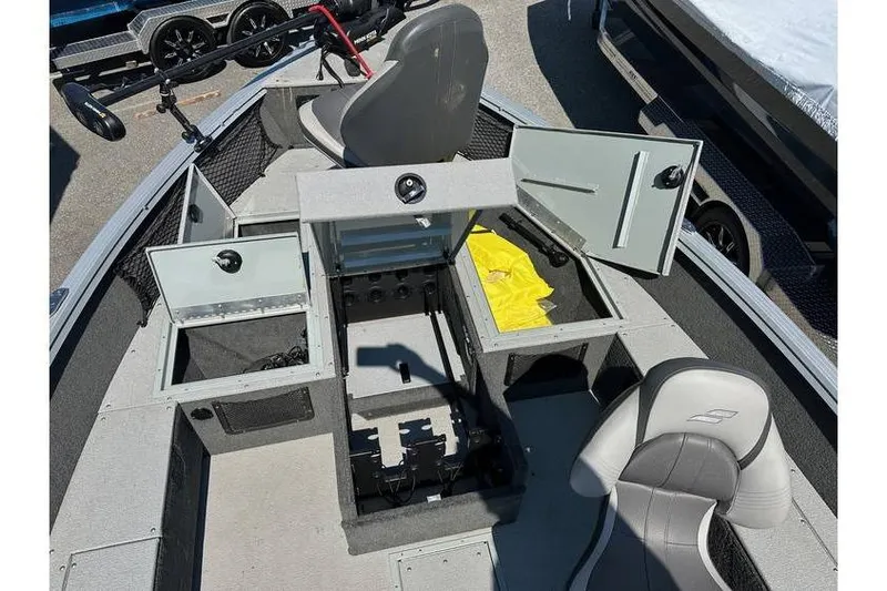 Slide: The Image of 2021 Starcraft Delta 168 Tiller boat interior with open storage compartments and seating. - 14