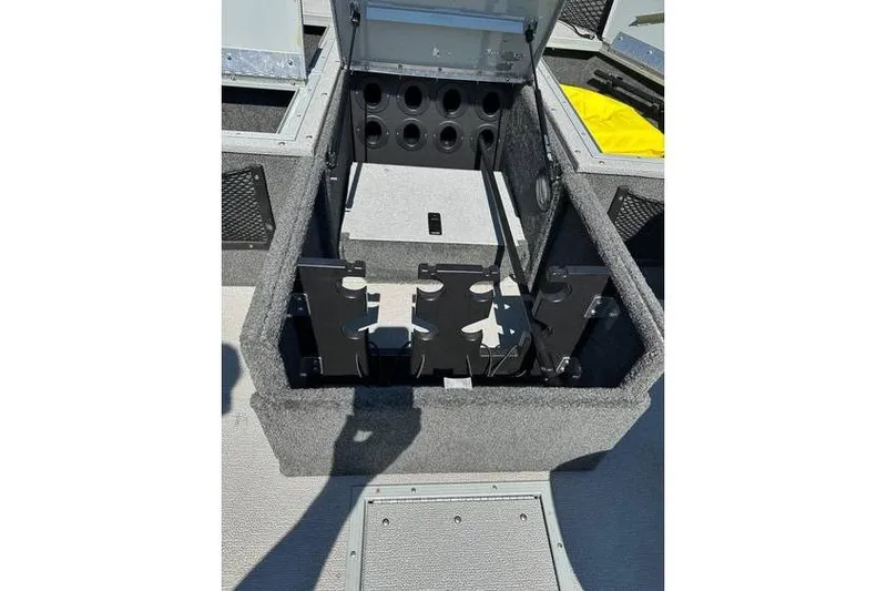 Slide: The Image of 2021 Starcraft Delta 168 Tiller boat storage compartment with rod holders and accessories. - 15