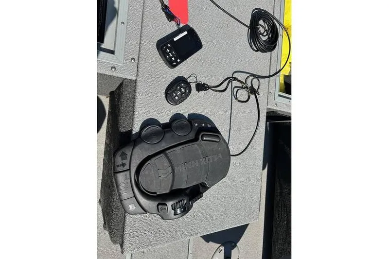 Slide: The Image of 2021 Starcraft Delta 168 Tiller boat controls and accessories on deck. - 17
