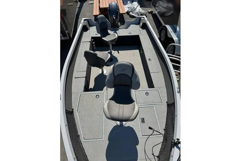 Slide: The Image of 2021 Starcraft Delta 168 Tiller boat interior with Yamaha F70LA engine and trailer. - 21