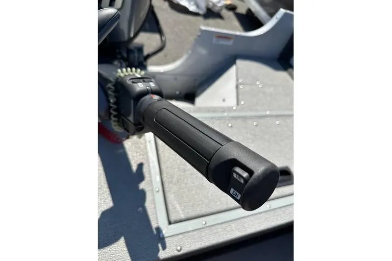 Slide: The Image of Close-up of 2021 Starcraft Delta 168 Tiller handle with Yamaha F70LA motor. - 24